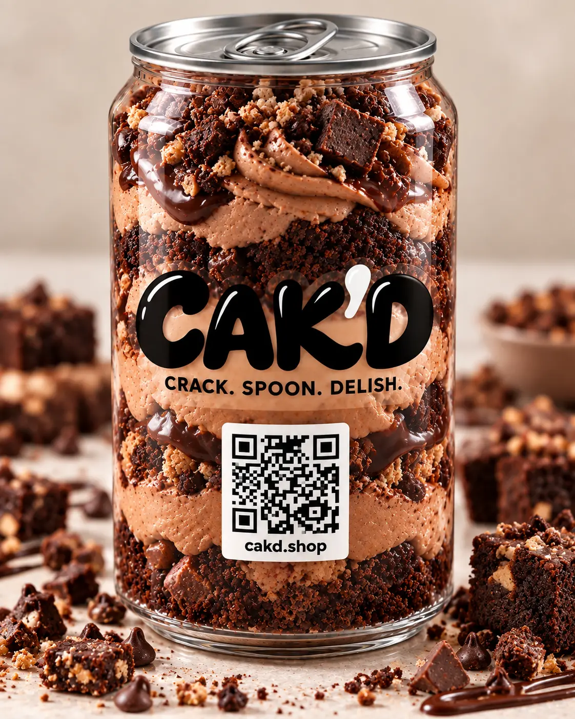 CAK'D Chocolate Fudge Crunch in a clear pull-tab can with fudge and chocolate pieces